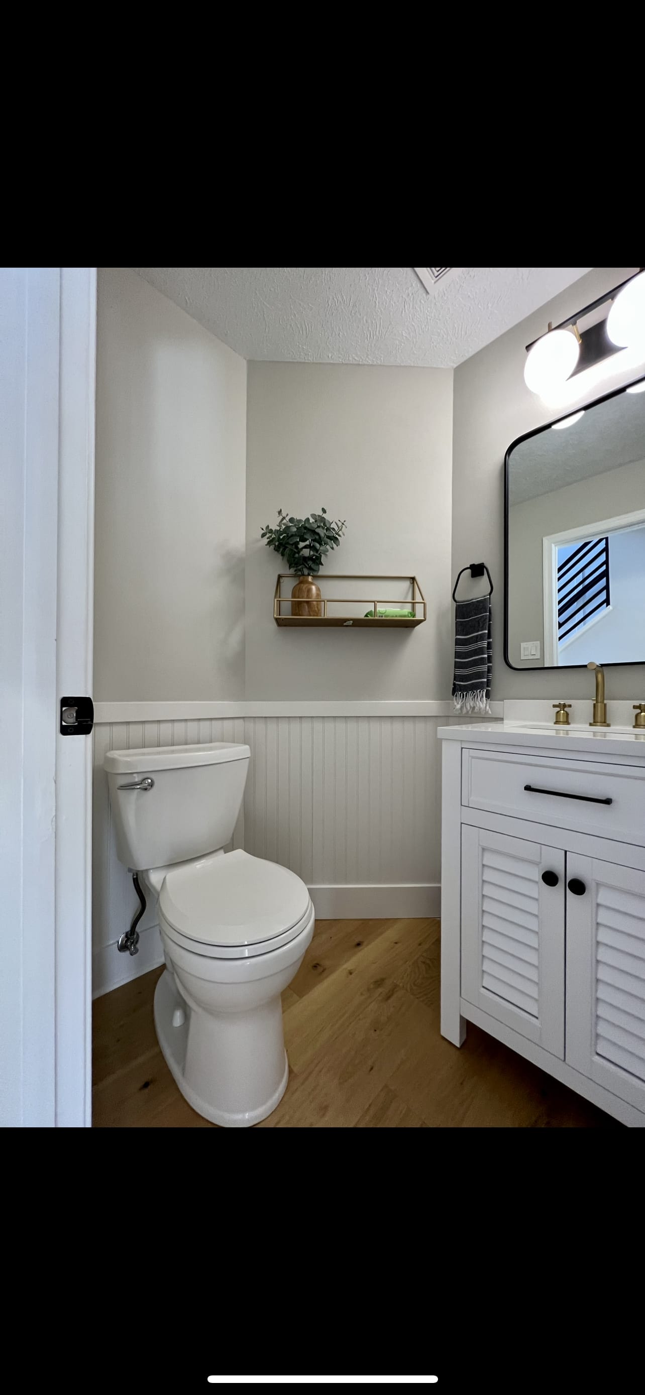 Powder room · Beadboard + gold
